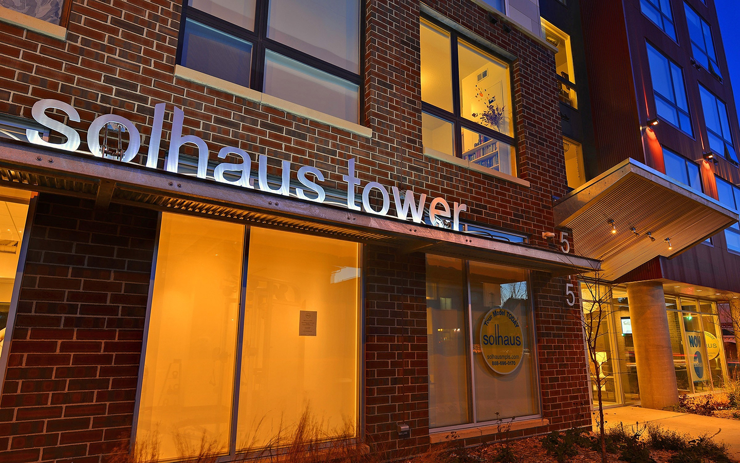 4-11-135_Solhaus Tower_Exterior Entrance_Night_W